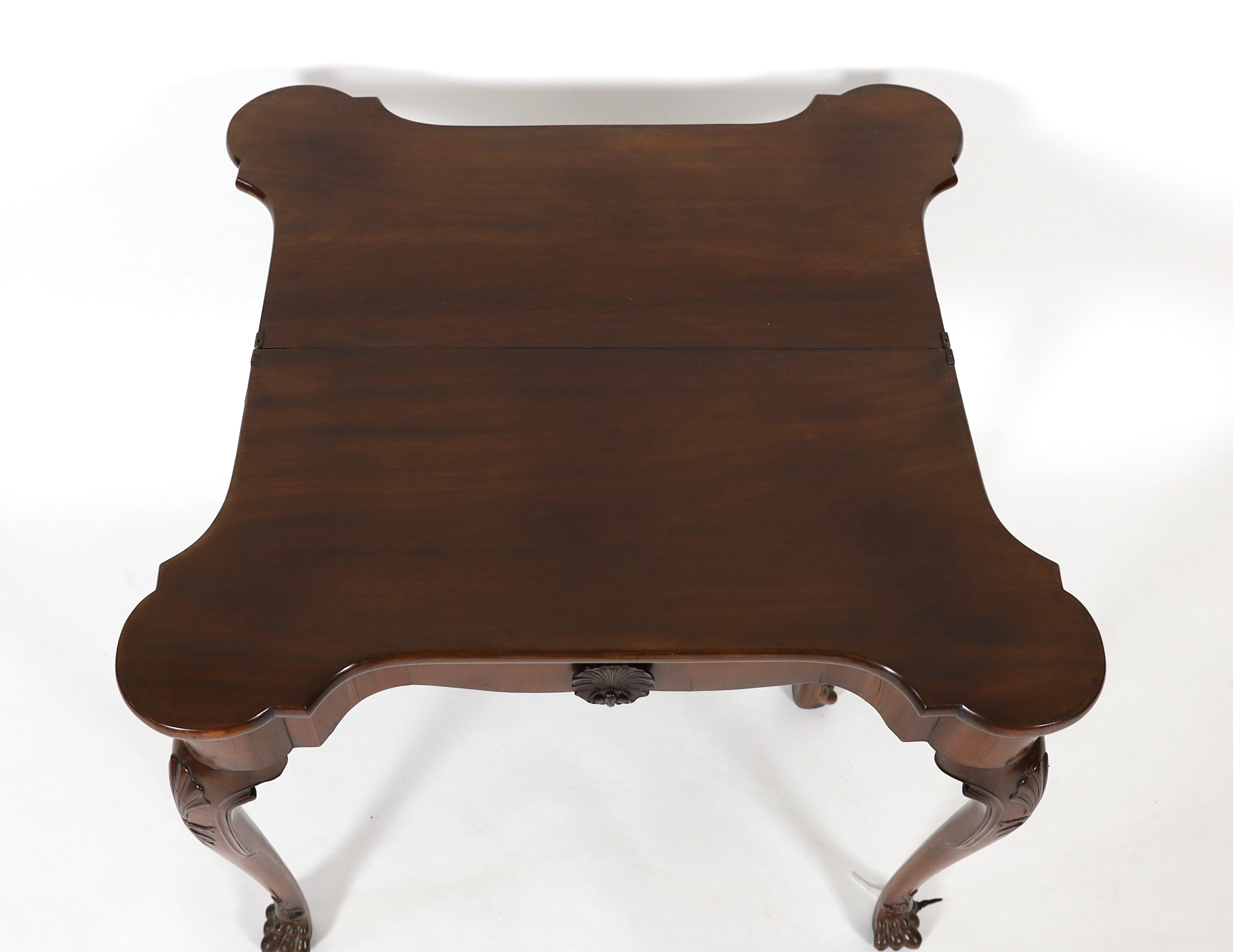 A George II mahogany serpentine folding top tea table, 80cm wide, 40cm deep, 75cm high